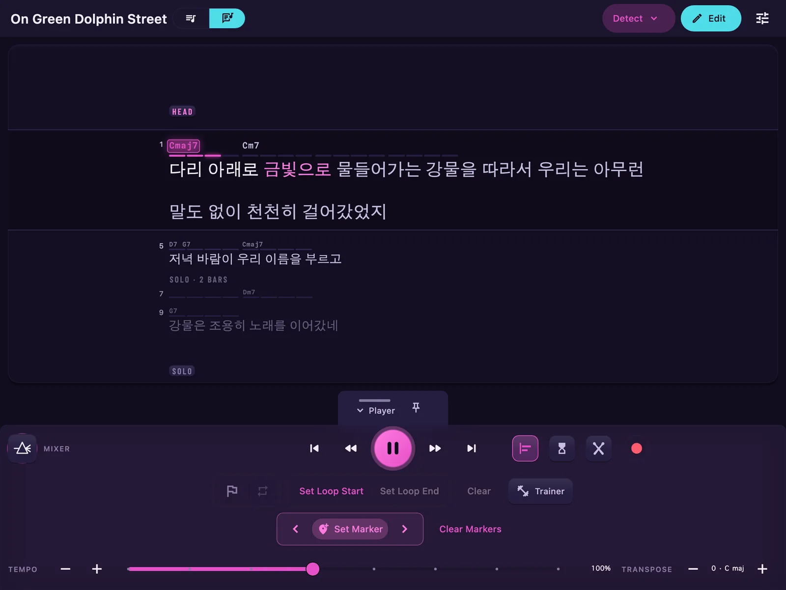 The Karaoke page of a song sung in Korean: three lines of Hangul, the phrase being sung lit word by word, its long first line wrapped onto a second row with the whole phrase on the page, and the chord ladder in time above the words.