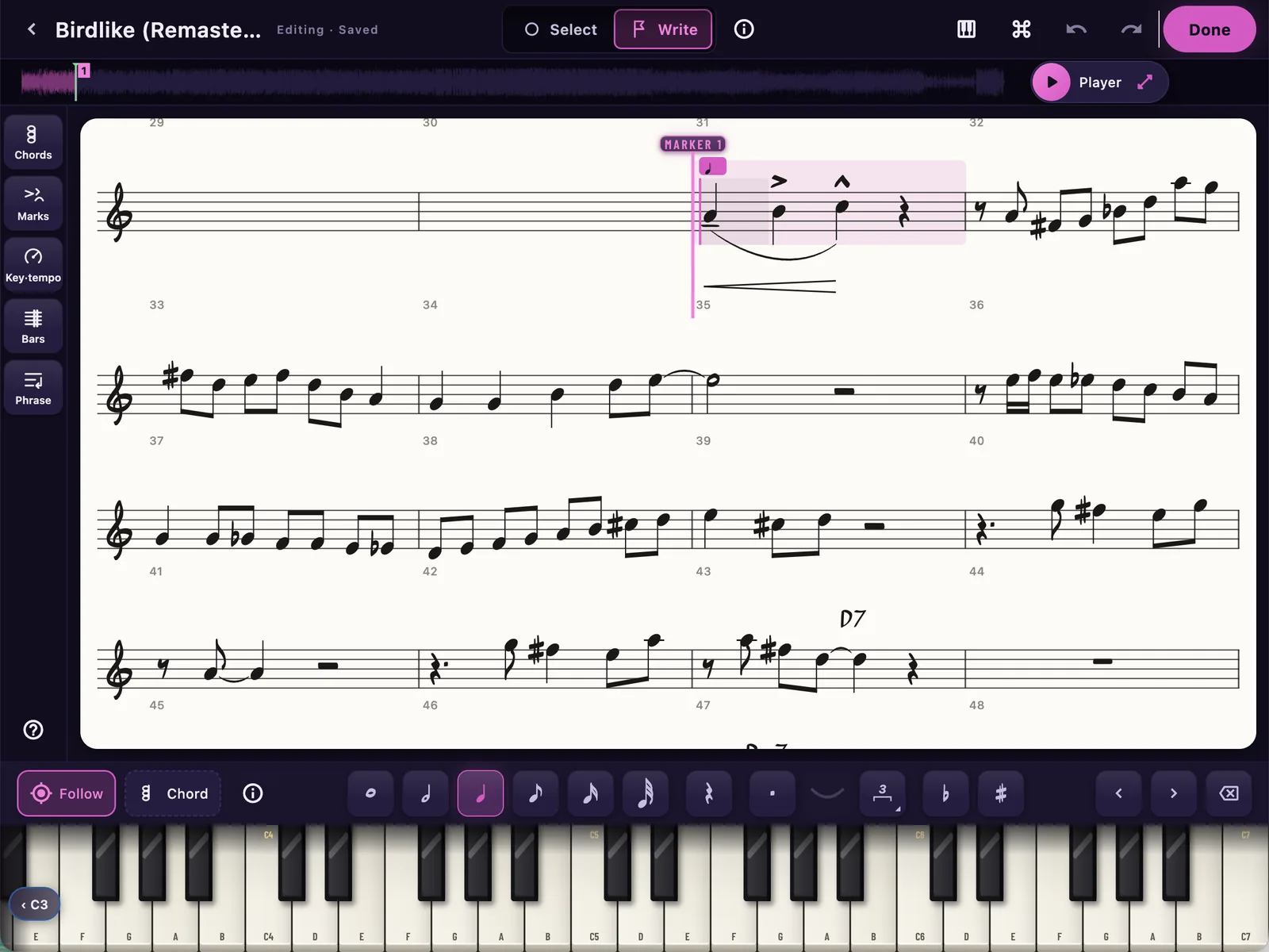 The Transcription Editor on Birdlike: a transcribed solo engraved on the song's own bars, with accents, a slur, a hairpin, ties and chord symbols; the caret in Write mode on bar 35 under Marker 1, the recording's waveform across the top; the category rail down the left, the note values under the page and a piano along the bottom.